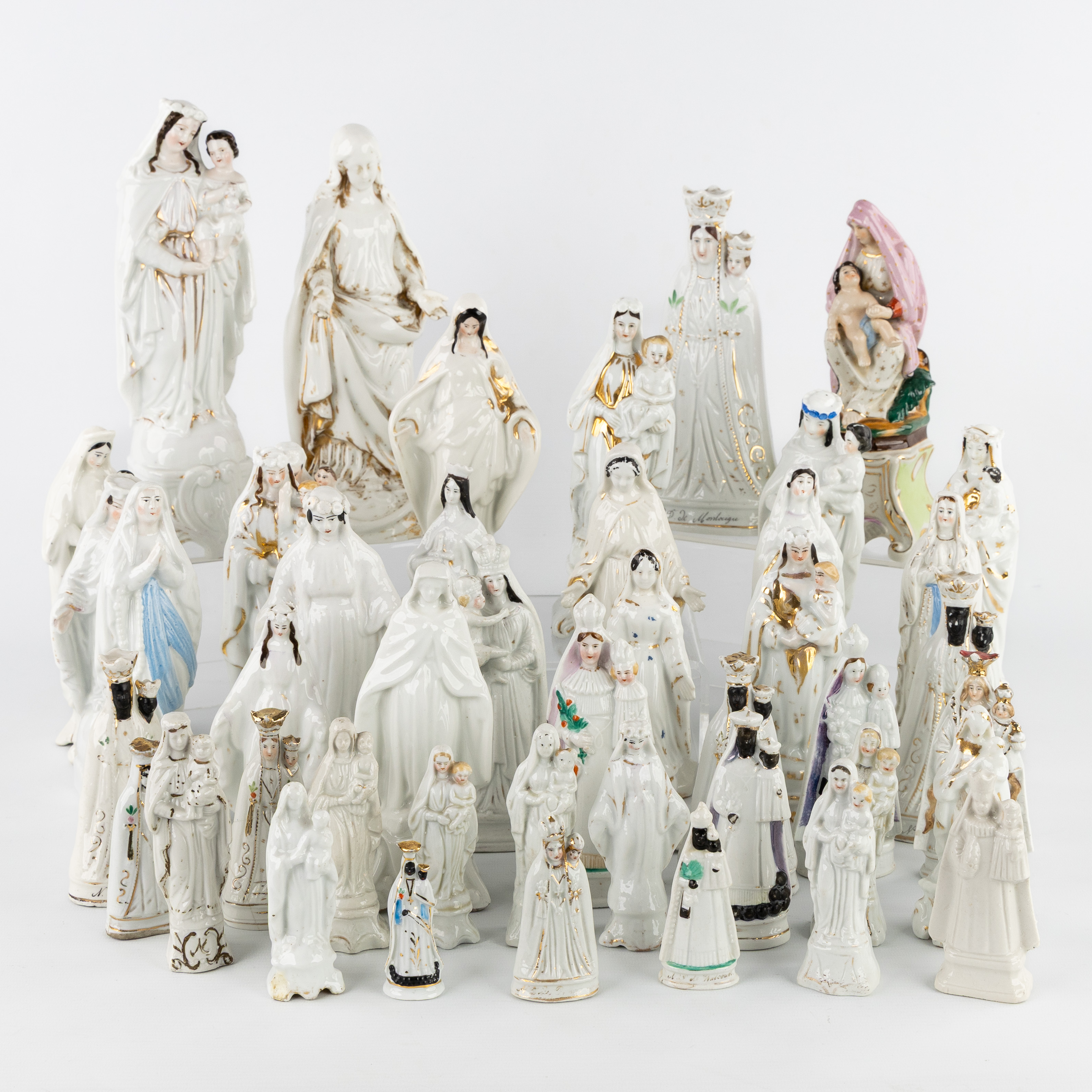 A Collection of 45 porcelain statues of Our Lady, Vieux Bruxelles/Paris, Andenne and Tournai, circa 1900. (L:11 x W:11 x H:24 cm)